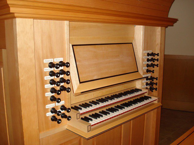 Two keyboards and stop knobs of the Fritts organ.