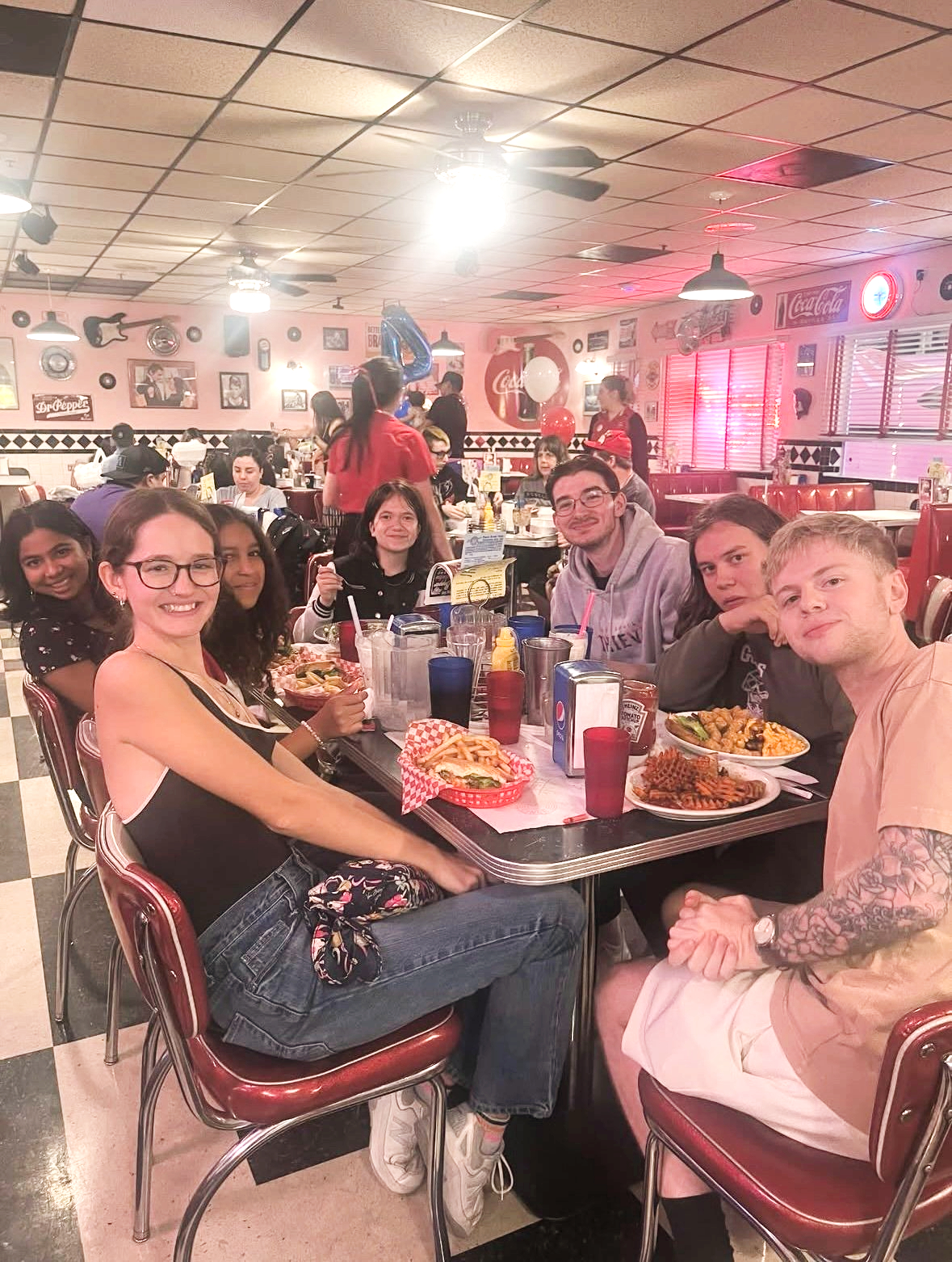 Young people sharing a meal together.