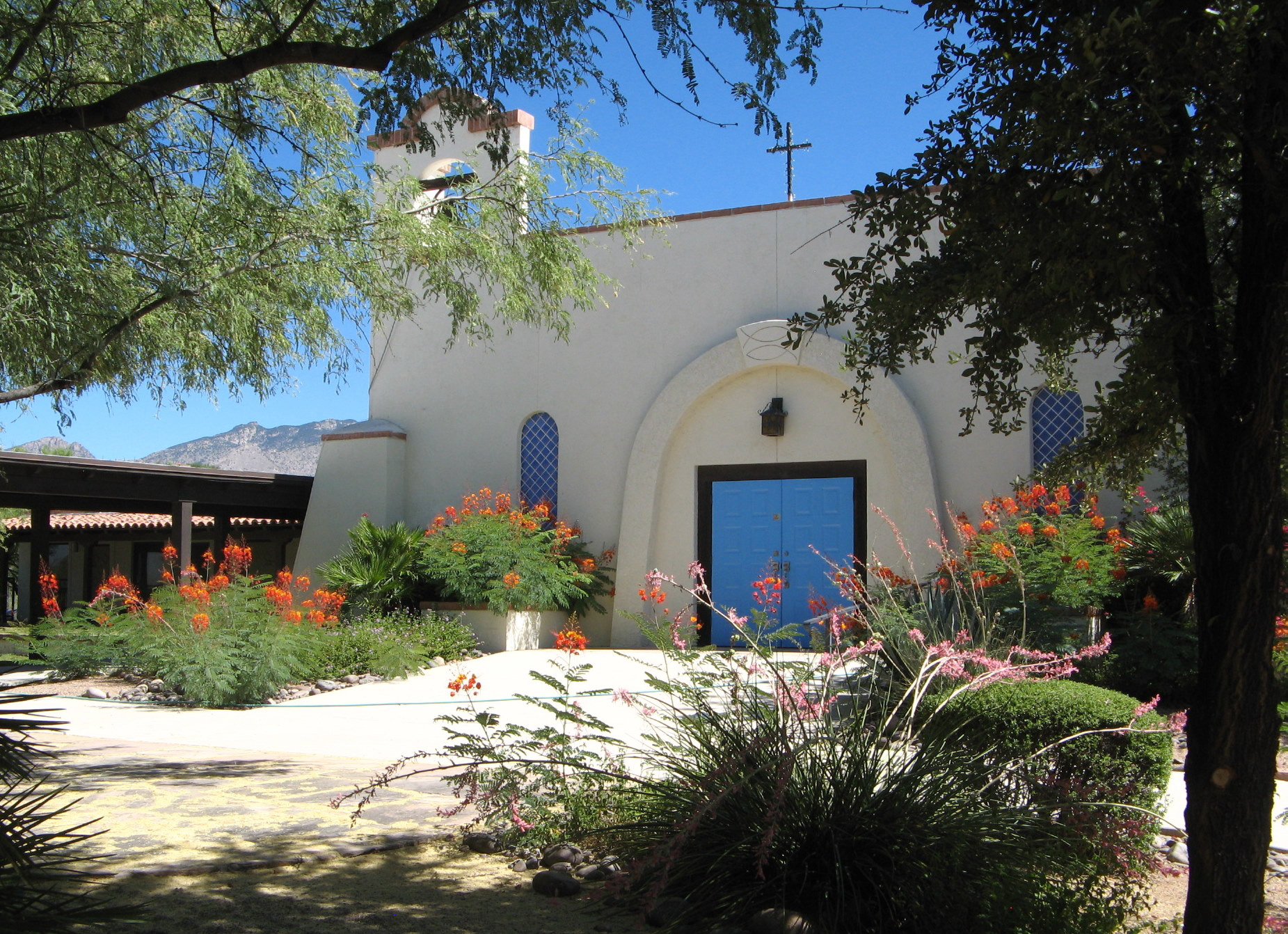 The church’s arched entrance and shaded courtyard.