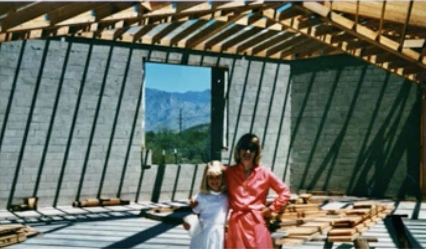 An adult and child inside the new sanctuary during construction.